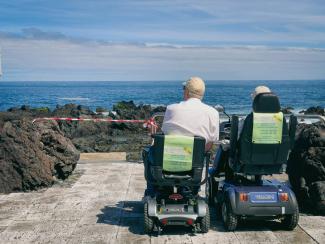 a couple of people that are sitting in some chairs by Guillermo Latorre courtesy of Unsplash.