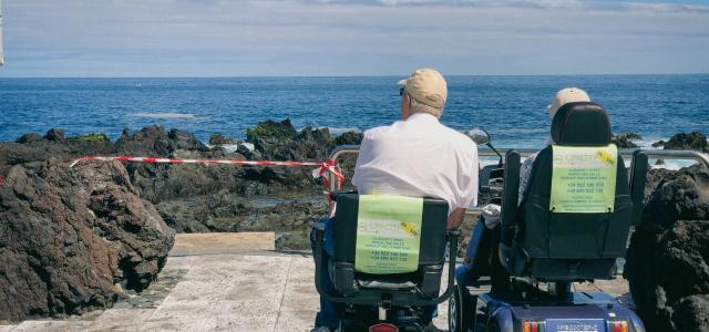 a couple of people that are sitting in some chairs by Guillermo Latorre courtesy of Unsplash.